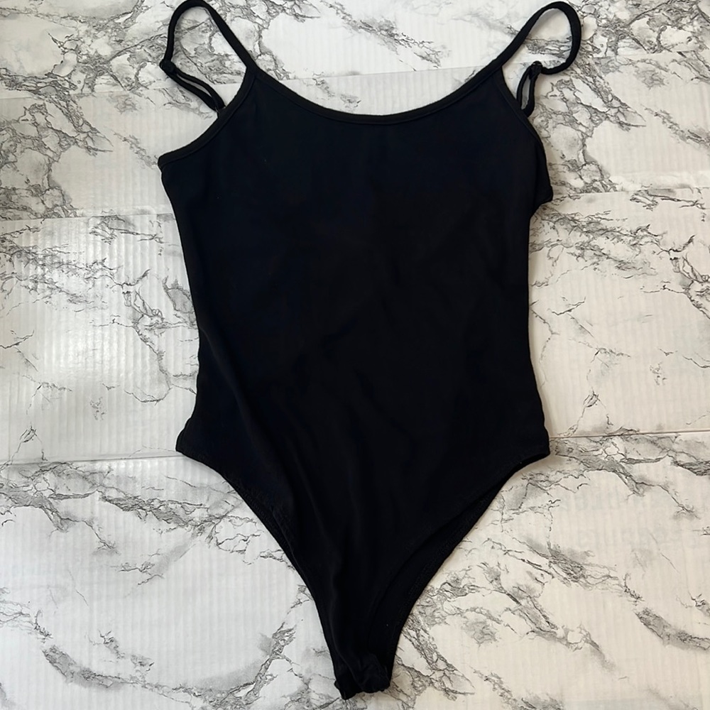 Shrinking violet black cami bodysuit.